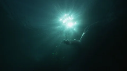 Sunshine through the water and the ice in the Arctic Ocean – Underwater shot Stock Footage 100598261