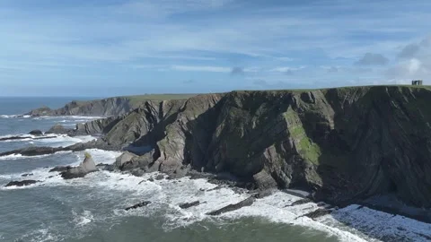 Sunshine, waves and cliffs - aerial/drone shot - Hartland Quay Stock Footage 270209004
