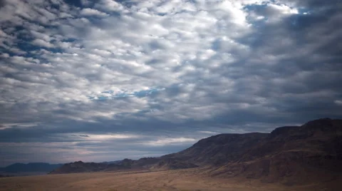 SUNUP OVER EDGE OF MOUNTAINRANGE HD Stock Footage 45342397