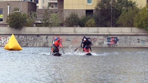 Sup board race with two teams on channel slow motion Video stock 134315772