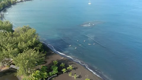 SUP surf group lesson in Pointe Venus, Mahina, Tahiti, French Polynesia Stock Footage 194764146