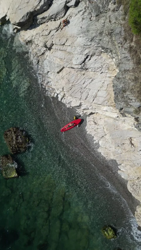 SUP surfer guy with a board and paddle on the seashore on a beautiful view of Stock Footage 252061854