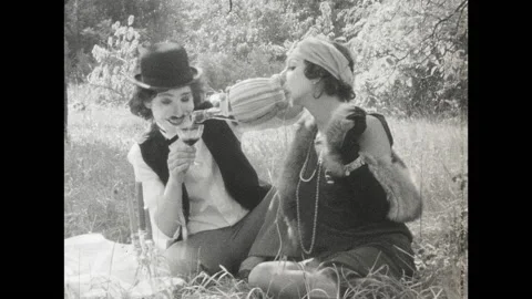 SUPER 8 - 1930's style Chaplin drinking red wine Stock Footage 145450788