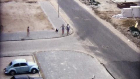 Super 8 Amsterdam 1973: Two Girls Walking In The Suburbs With A Dog Stock Footage 96491201