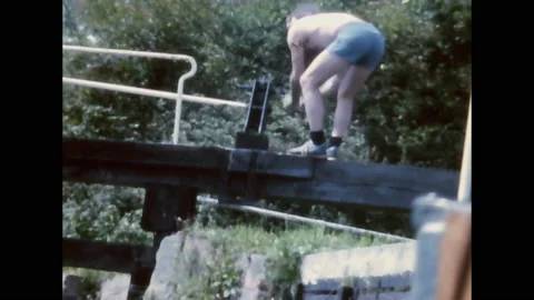 Super 8 - England 1982 - Man Opens The Barrier Of A Canal For Navigation Stock Footage 139963357