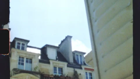 Super 8 film burn effect overlooking parisian buildings Stock Footage 312993777