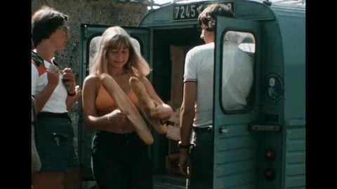 SUPER 8 - FRANCE - people on queue to buy bread to mobil bakery - Narjac - 1977 Video stock 133920892