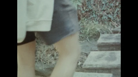 Super 8 - Hopping Across Stone Steps Video stock 119807236