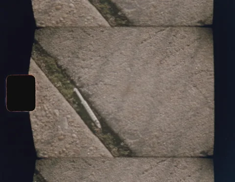 SUPER 8 - HYPERDERMIC SYRINGE ON PAVEMENT Stock Footage 141189687