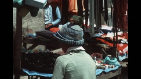 SUPER 8 - PERU - kid with a parrot on his hat at the market - urubamba - 1981 Stock Footage 168667100