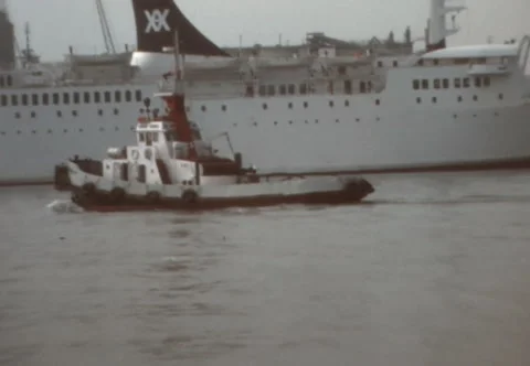 SUPER 8 - SPAIN - tug boat and cruise ship - Barcelona - mid 1970s Stock Footage 220091665