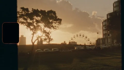 Super 8 - Sunset Ferris Wheel - Long Shot Stock Footage 120335662