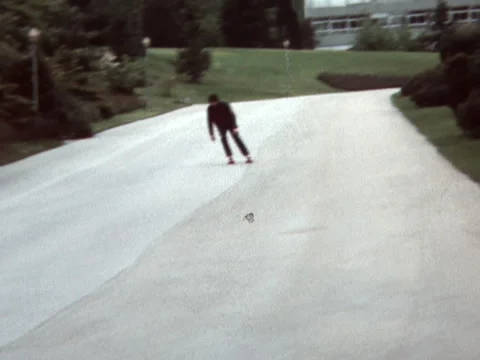 Super 8 - Switzerland - rollerskater roller skate and fall down - early 1980s Stock Footage 329935821
