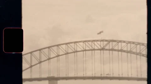 Super 8 | Sydney Harbour Bridge flags - Vintage Stock Footage 130426990