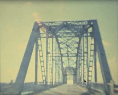 Super 8 USA crossing bridges with a 1984 Mercury Stock Footage 25657445