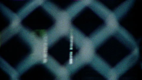 Super 8 view through metal fence as subway revels peeps of the nyc Vídeos de archivo 251212136