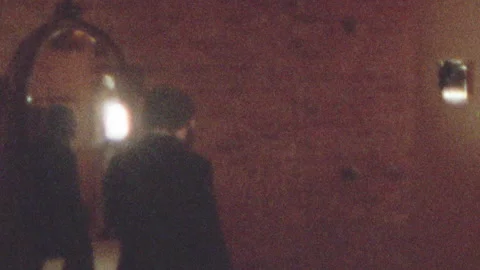 Super 8 view tracking subject through industrial building in brooklyn Stock Footage 251230604