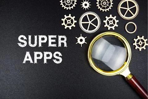 Super Apps text message with magnifying glass on black background Foto stock