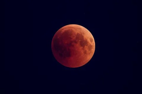Super Bloody Moon, full eclipse phase against starry sky background Fotos Stock