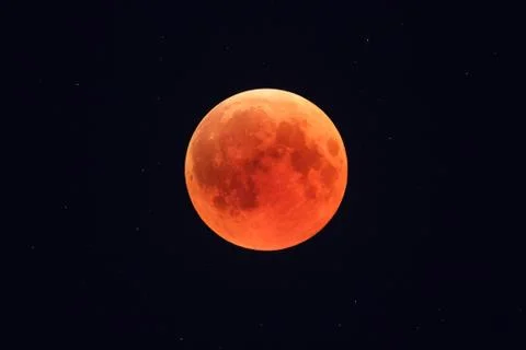 Super Bloody Moon, full eclipse phase against starry sky background Fotos Stock