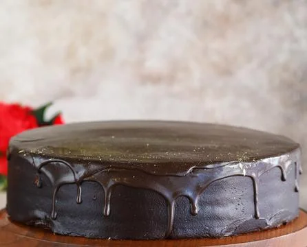 Super chocolate cake with chocolate icing for dessert Stock Photos