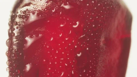 Super close up of bright fresh red Pomegranate fruit seed on white Видео 131715774