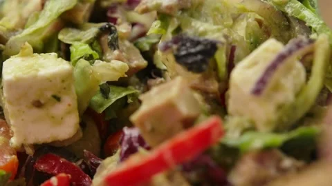Super close-up of delicious salad made of grilled meat with the fresh vegetables Stock Footage 233844672