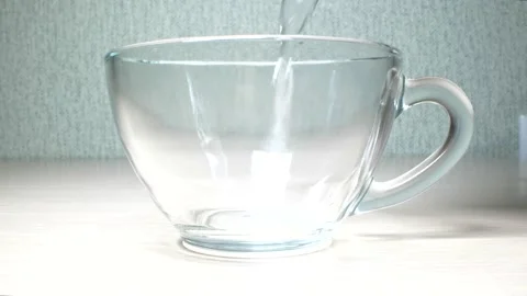 Super close up. details. clear water is poured into a transparent mug Stock Footage 137744002