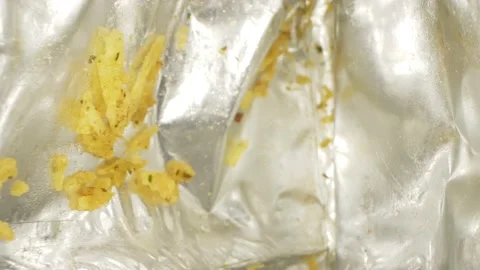 Super close up. the details. leftover potato chips inside the package Stock Footage 135877457