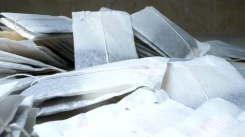 Super close up. details of a set of tea bags lying on the table Stock Footage 138916410