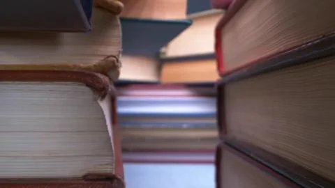 Super close up details. view between stacks of many books Stock Illustration