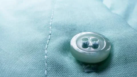 Super close elements of a button down blouse. textile background Stock Photos