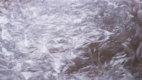 Super close up. elements of packaging cellophane material with bubbles Stock Footage 133550985
