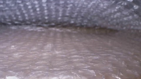 Super close up. elements of packaging cellophane material with bubbles Stock Footage 134373127