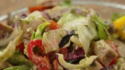 Super close-up of grilled meat cubes mixed with fresh vegetables and feta cheese Stock Footage 234051694