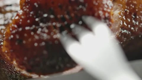 Super close-up of the Knife cutting a piece of juicy duck Stock Footage 226818577