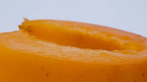 Super close macro of one half of apricot fruit. Rotating on the turntable. Stock Footage 92924025