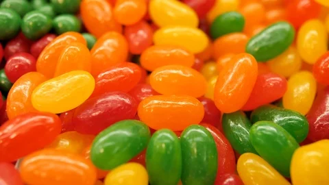 Super close up of a multi-colored dragee. Multicolored candys. Colored easter Video stock 125899724