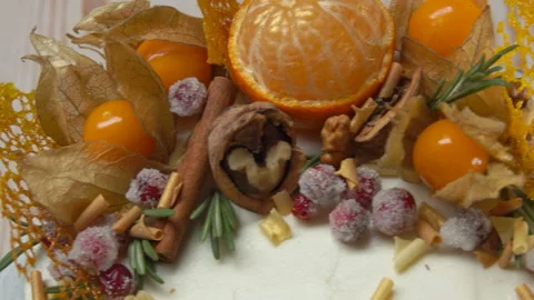 Super close-up panorama of chocolate cake decorations with physalis and oranges Stock Footage 221044337