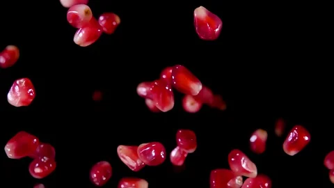 Super close-up of pomegranate grains falling in slow motion Stock-Footage 295655760