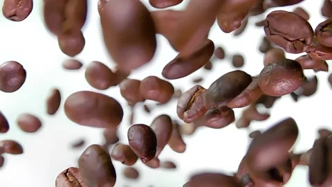 Super close-up of the roasted coffee beans rotating on the white background Stock-Footage 290516935