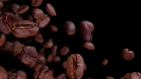 Super close-up of roasted coffee beans flying and rotating Stock Footage 297195722