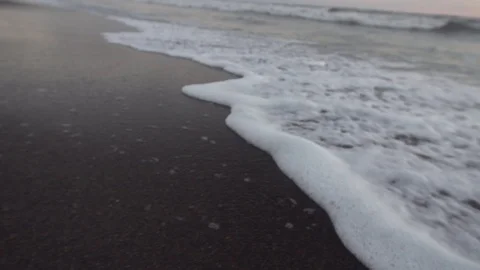 Super Close White Waves Lapping at Black Sand Beach Shore Slow Motion Stock Footage 87723837