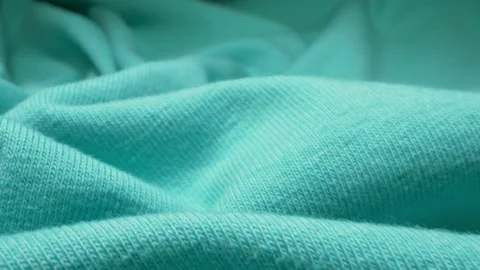 Super closeup. elements of a gentle blue blouse with frills. textile background Stock Footage 134666883