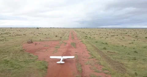 Super Cub takeoff flying drone aerial airplane runway Tsavo Kenya Africa 2 Stock Footage 232828163