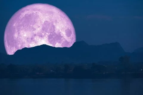Super full fish moon back on cloud and mountain on night sky Stock Photos