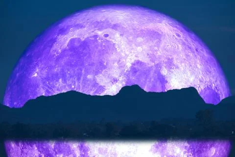 Super full fish moon back reflection on river and mountain on night sky Stock Photos