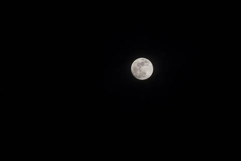Super full moon with dark background of dark night sky Stock Photos