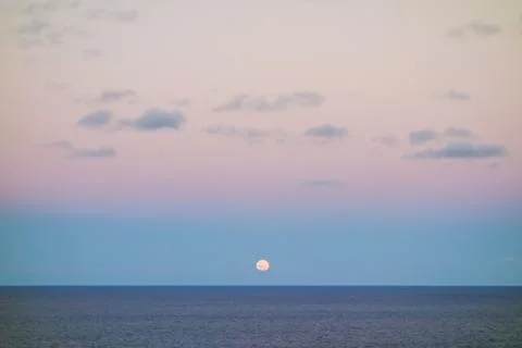 Super full moon rises up to sky, over the sea Stock Photos