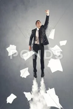 Super hero businessman flying out the office Stock Photos
